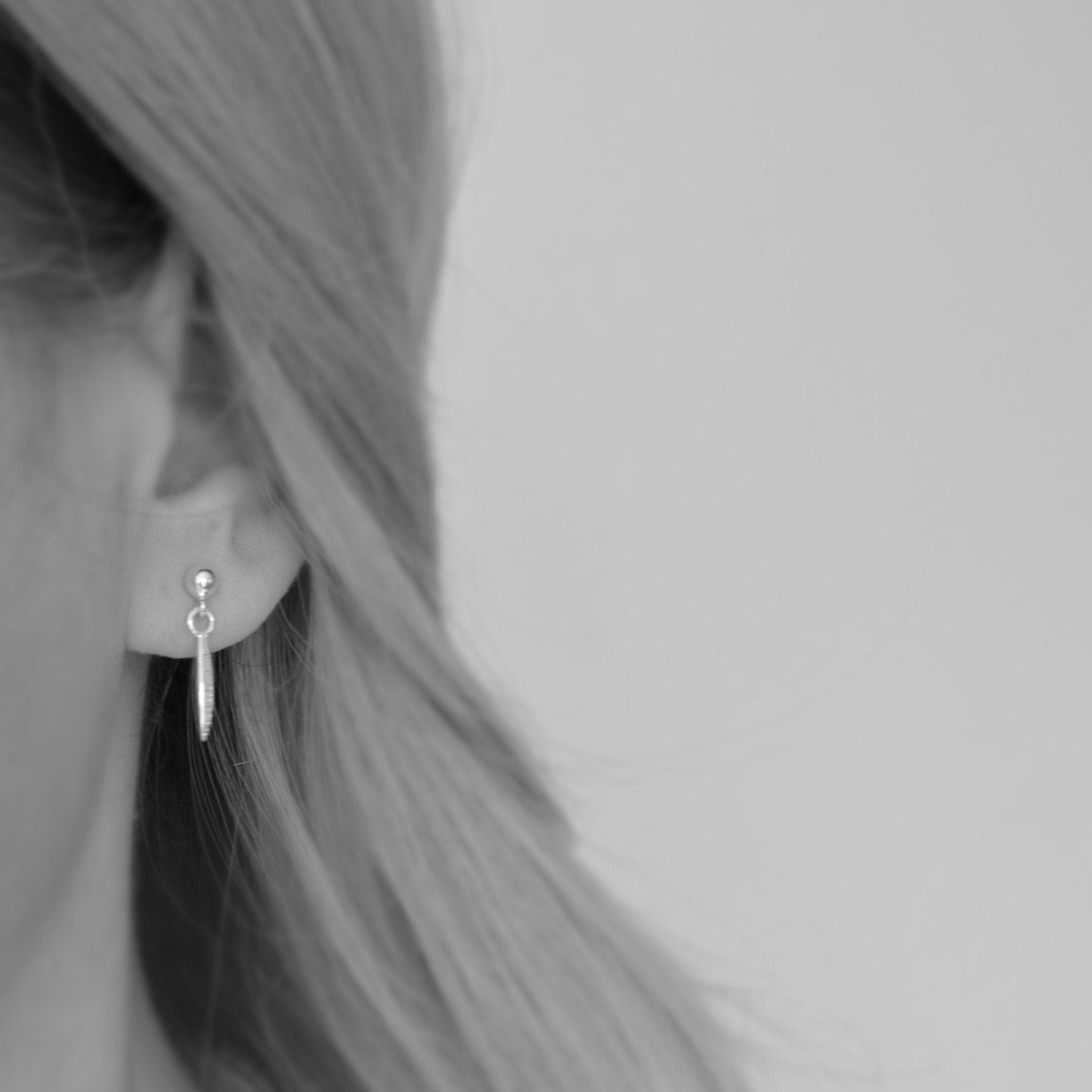 Oxidised sterling silver ball and spear stud earrings.