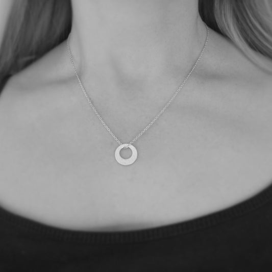 Small minimalist hammered sterling silver necklace.