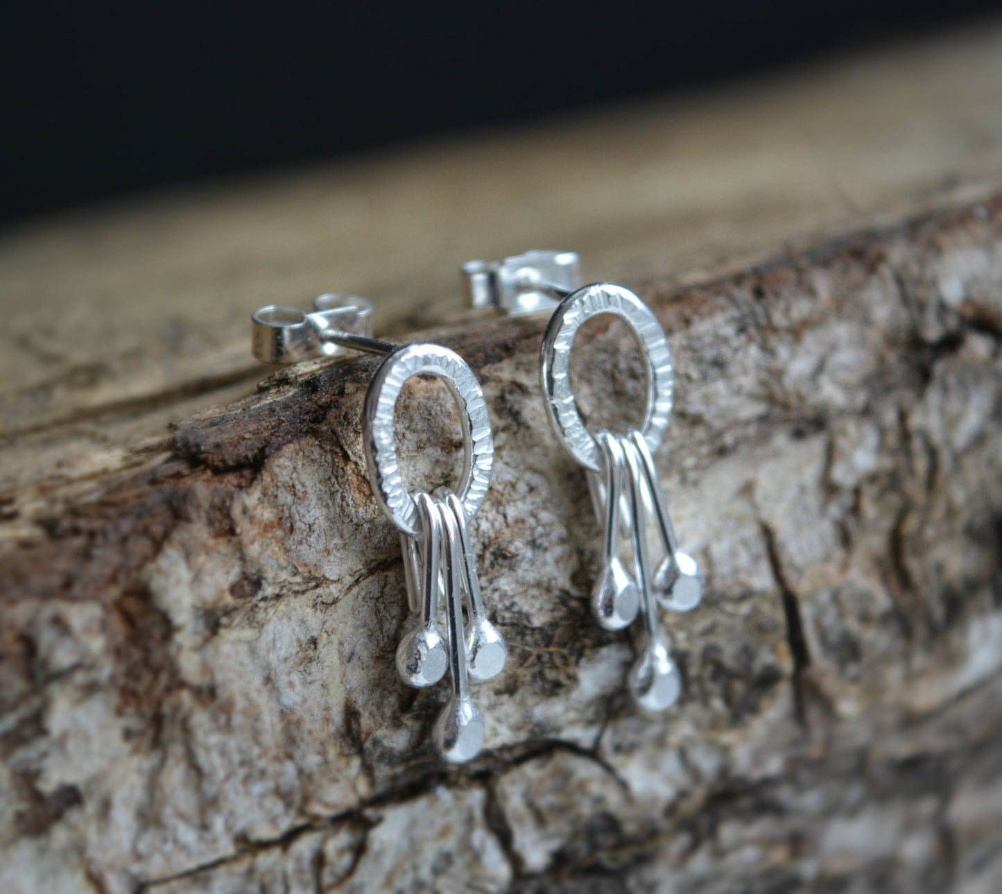 Dangle sterling silver oval stud earrings.