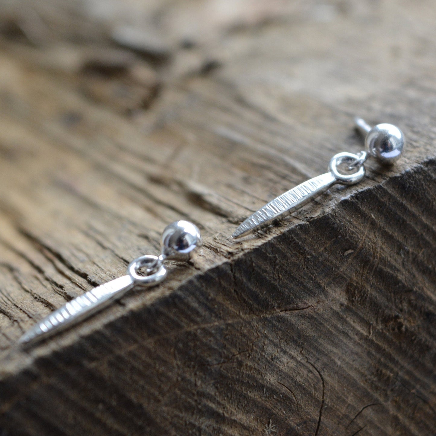 Oxidised sterling silver ball and spear stud earrings.