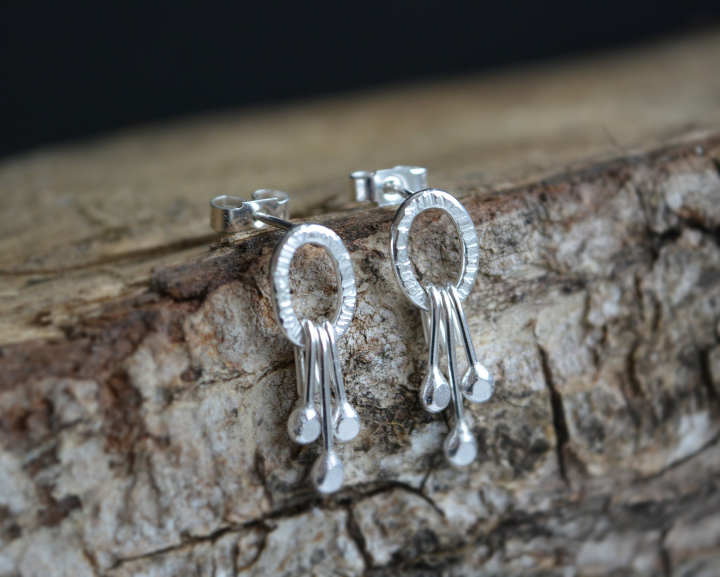 Dangle sterling silver oval stud earrings.