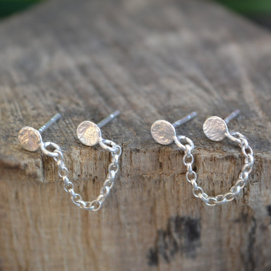 Double pierced chain sterling silver stud earrings.