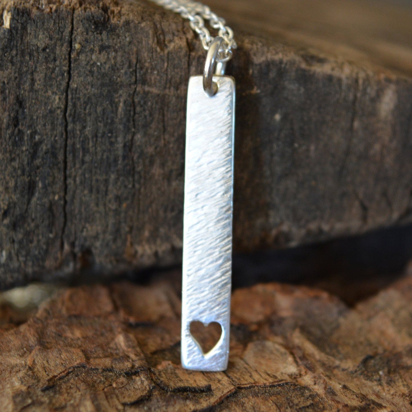 Sterling silver rectangular necklace with a heart