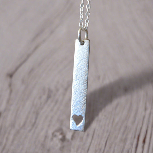 Hammered sterling silver rectangular necklace with a heart