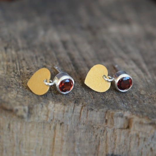 Garnet sterling silver, gold plated heart stud earrings.