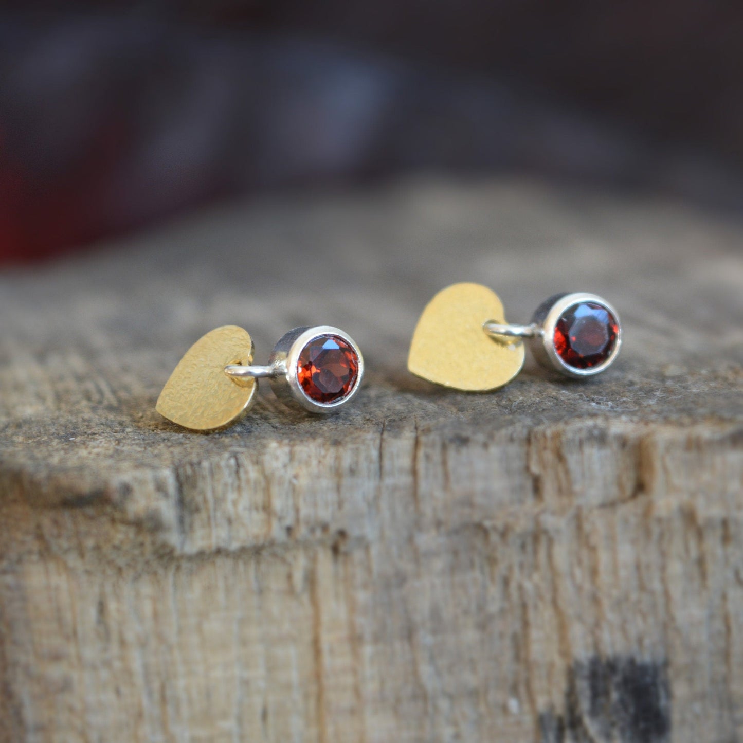 Garnet sterling silver, gold plated heart stud earrings.