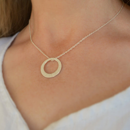 Minimalist hammered sterling silver washer necklace.