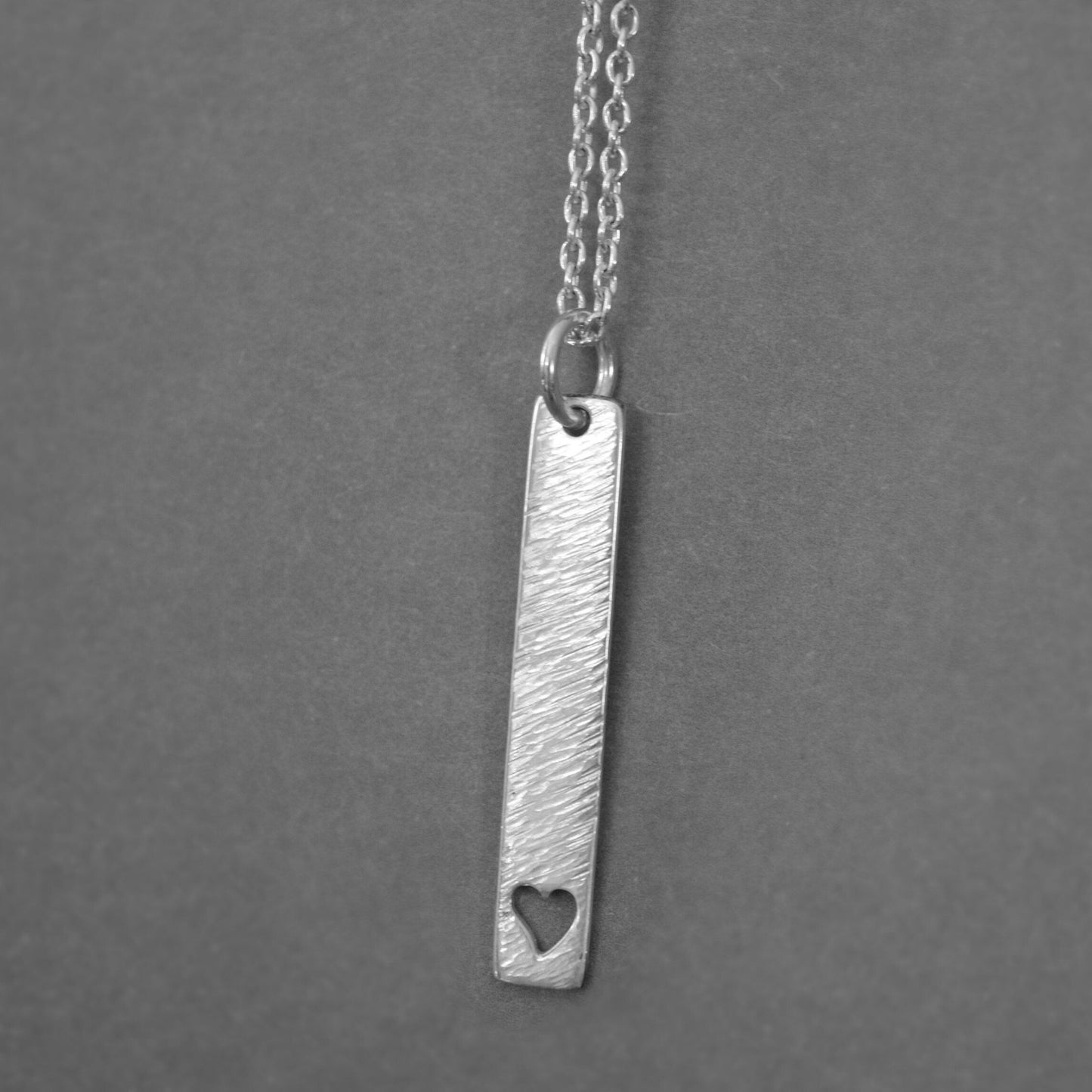 Hammered heart sterling silver rectangular necklace.