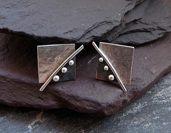 Square stud earrings in sterling silver.