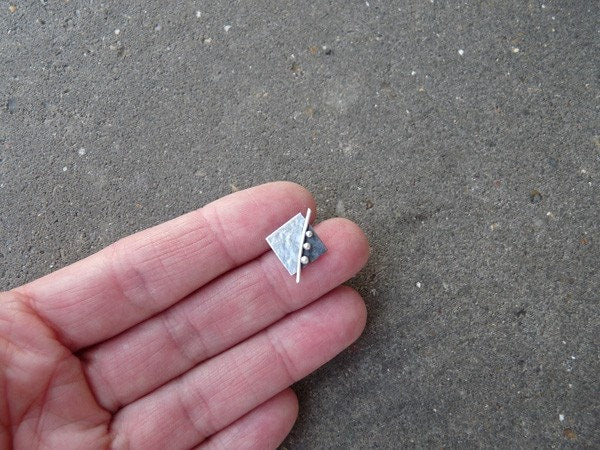 Square stud earrings in sterling silver.