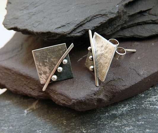 Square stud earrings in sterling silver.