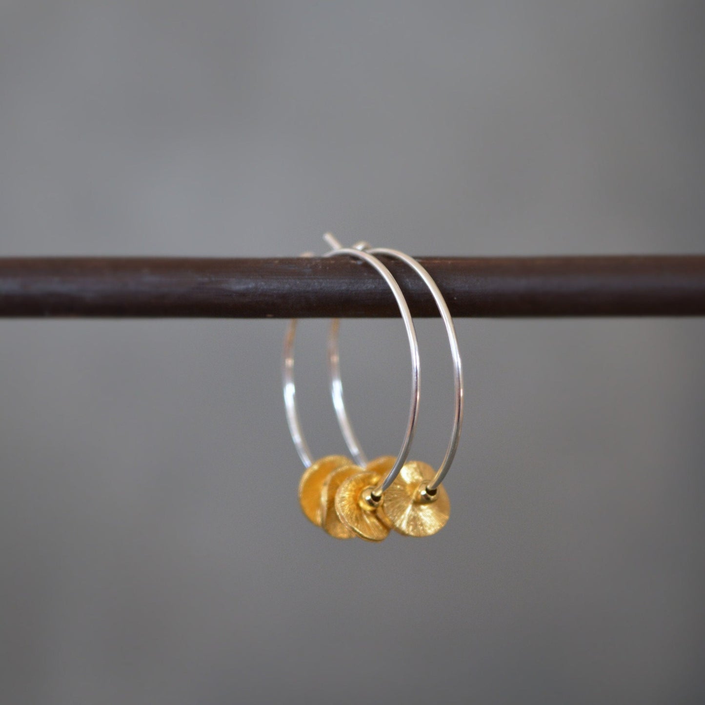 Sterling silver and 24k gold vermeil hoops.