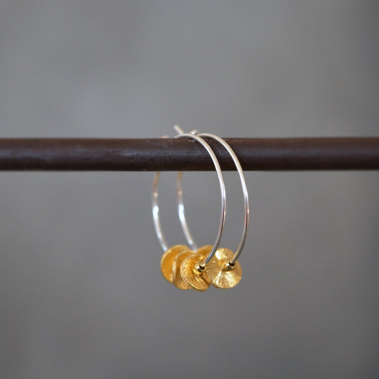 Sterling silver and 24k gold vermeil hoops.