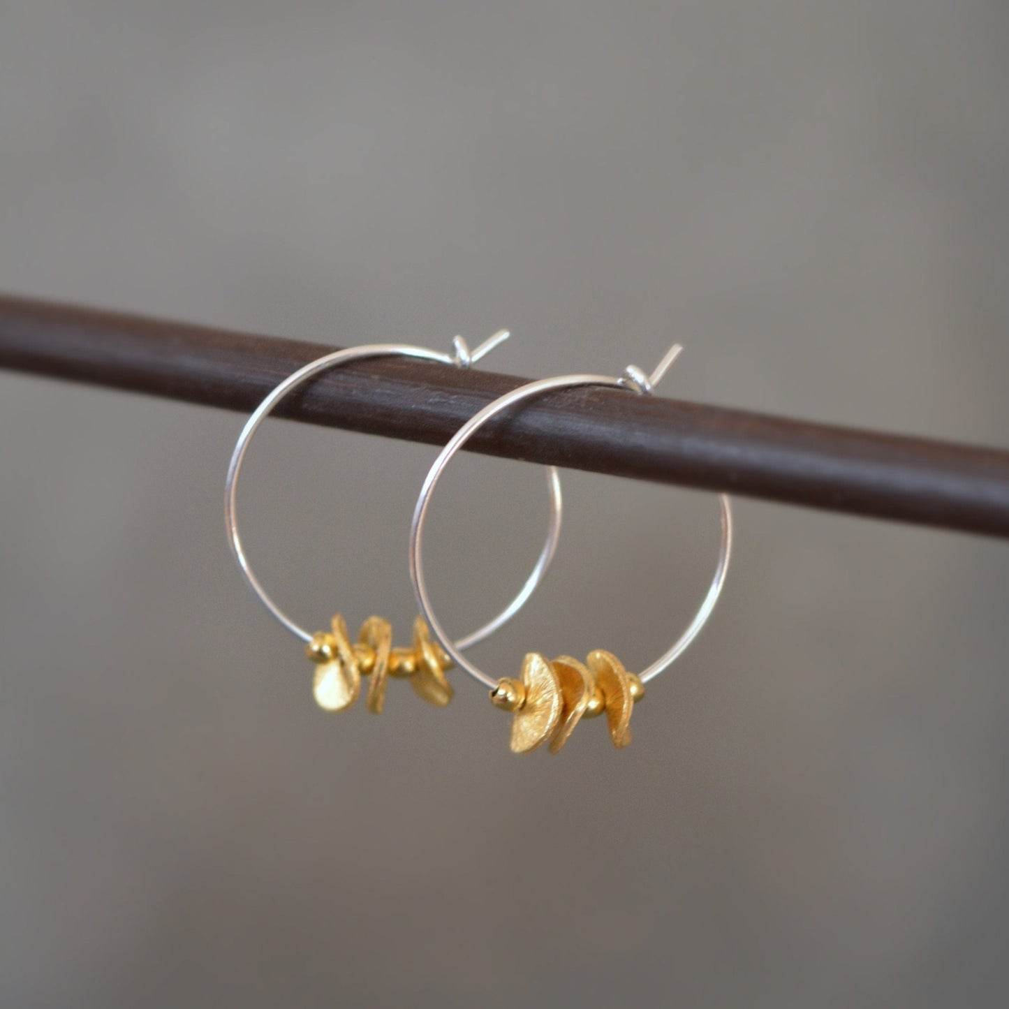 Sterling silver and 24k gold vermeil hoops.
