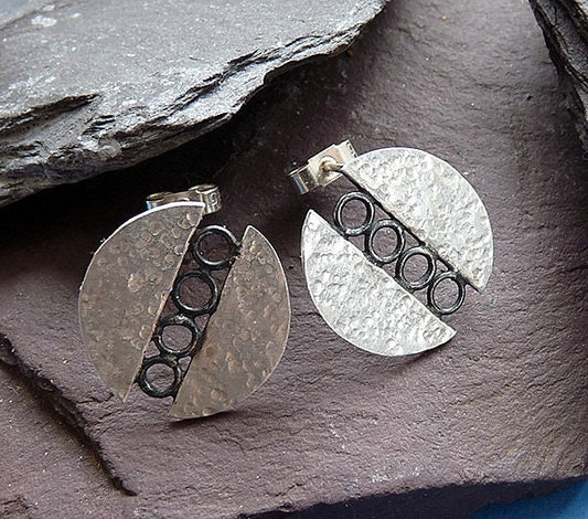 Sterling silver circle stud earrings.