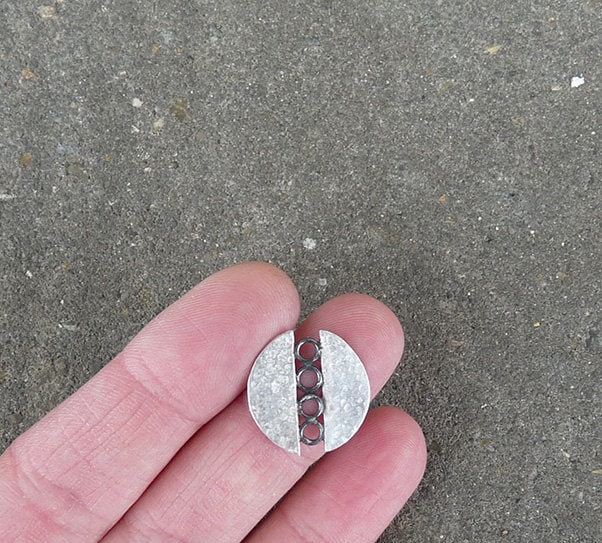 Sterling silver circle stud earrings.