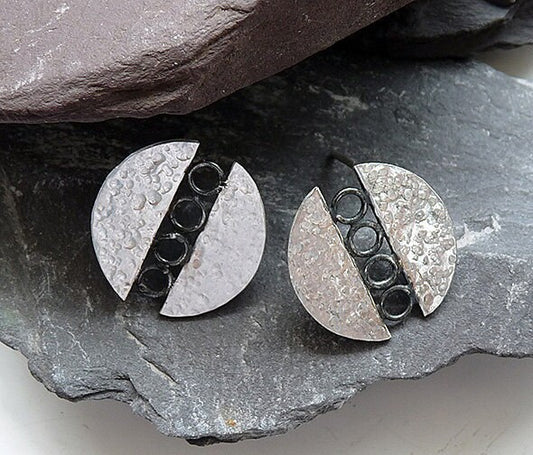 Sterling silver circle stud earrings.