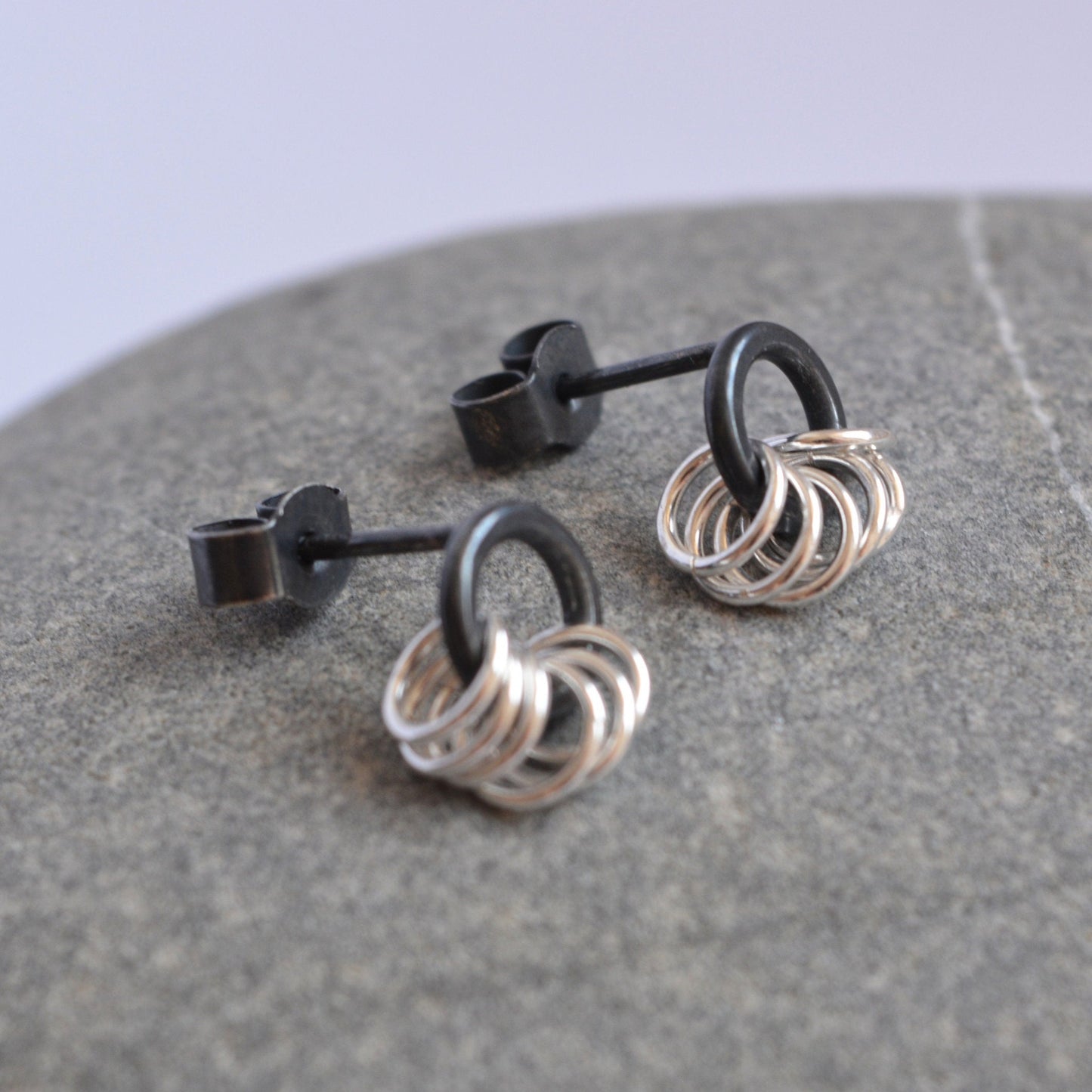 Small sterling silver circle stud earrings.