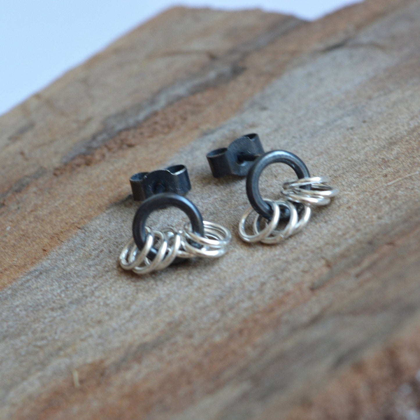 Small sterling silver circle stud earrings.