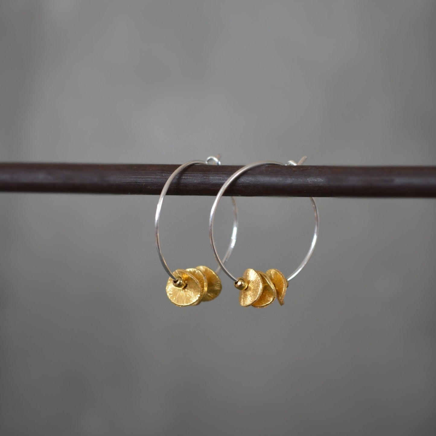 Sterling silver and 24k gold vermeil hoops.