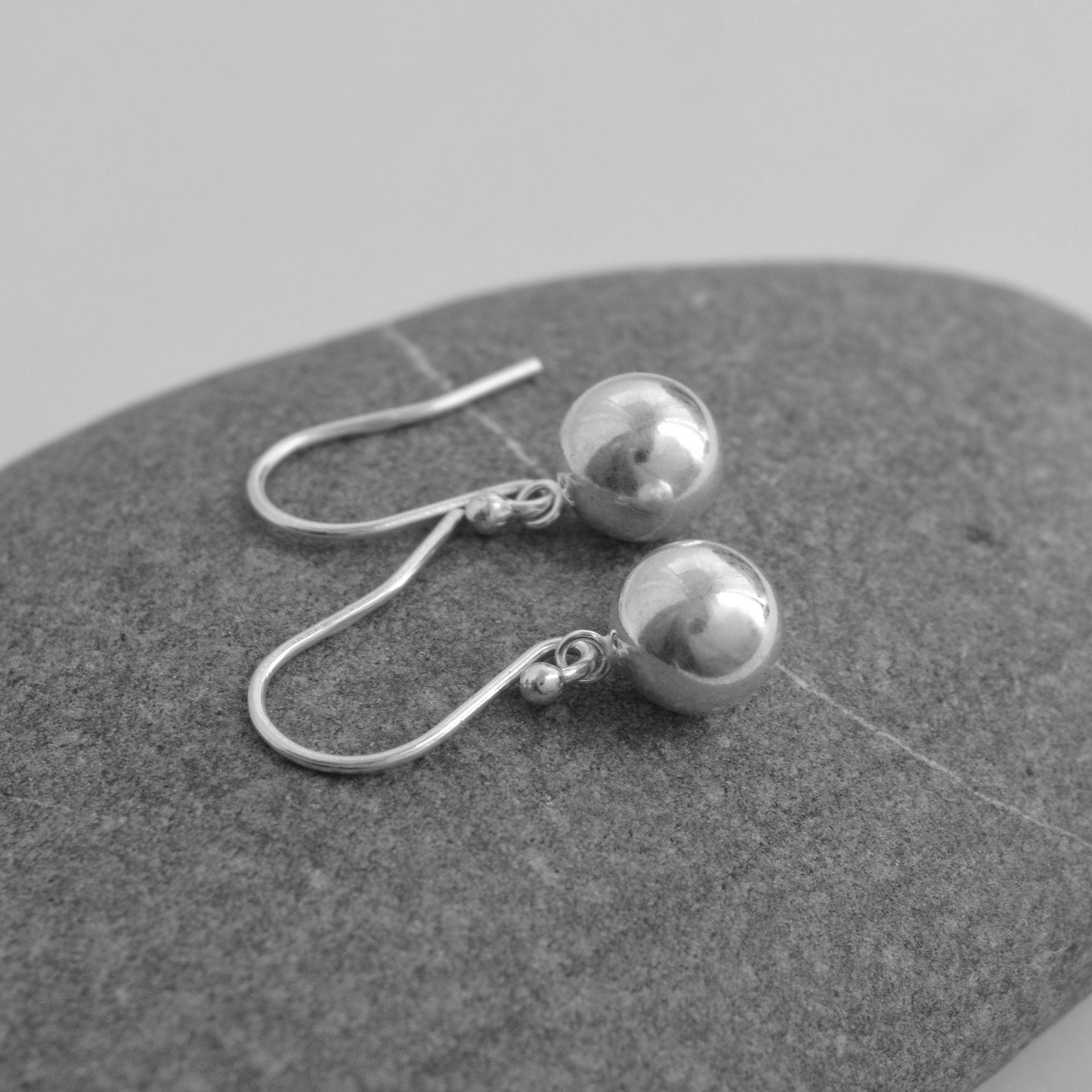 Ball sterling silver dangle earrings.
