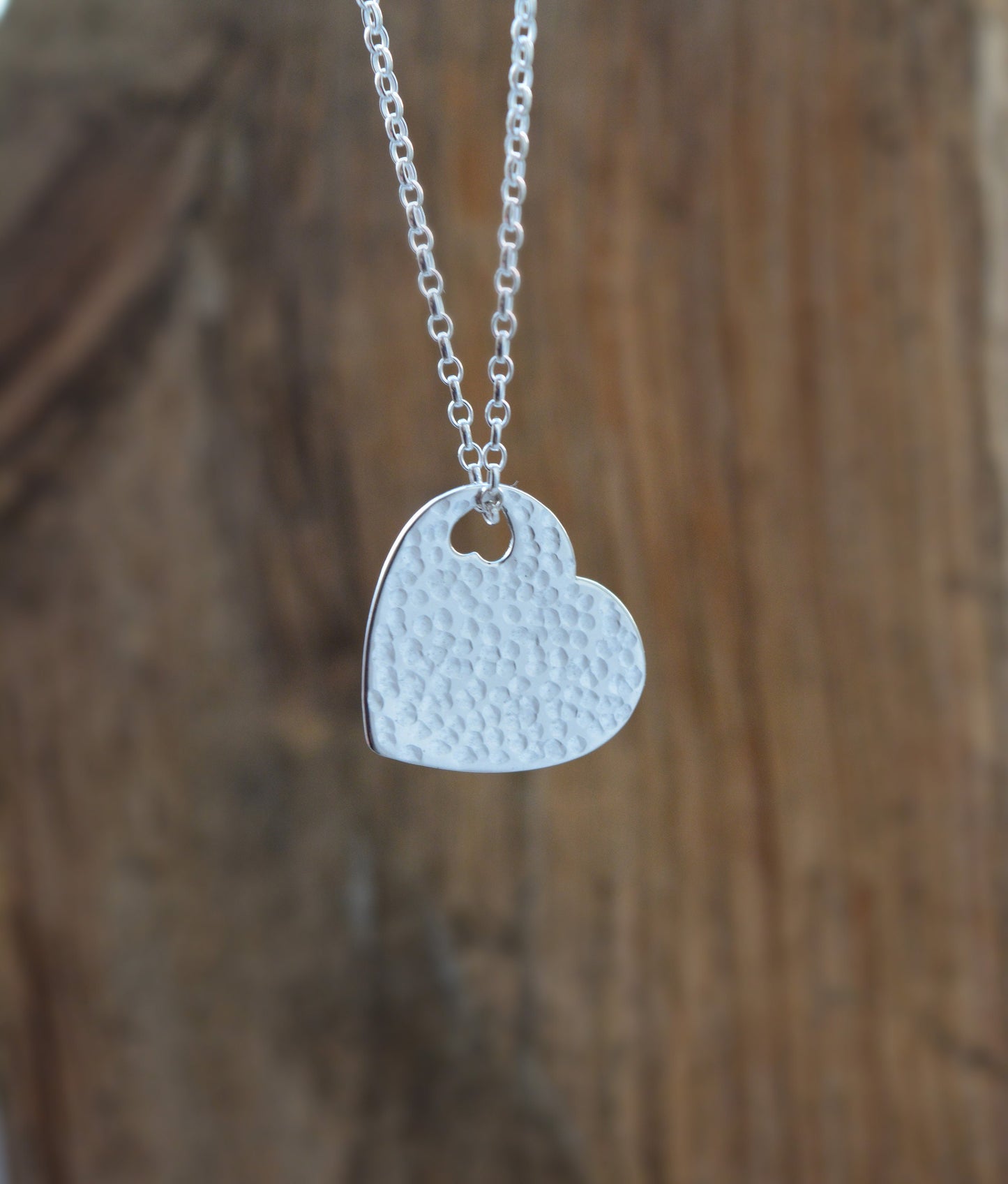 Hammered sterling silver heart necklace pendant.