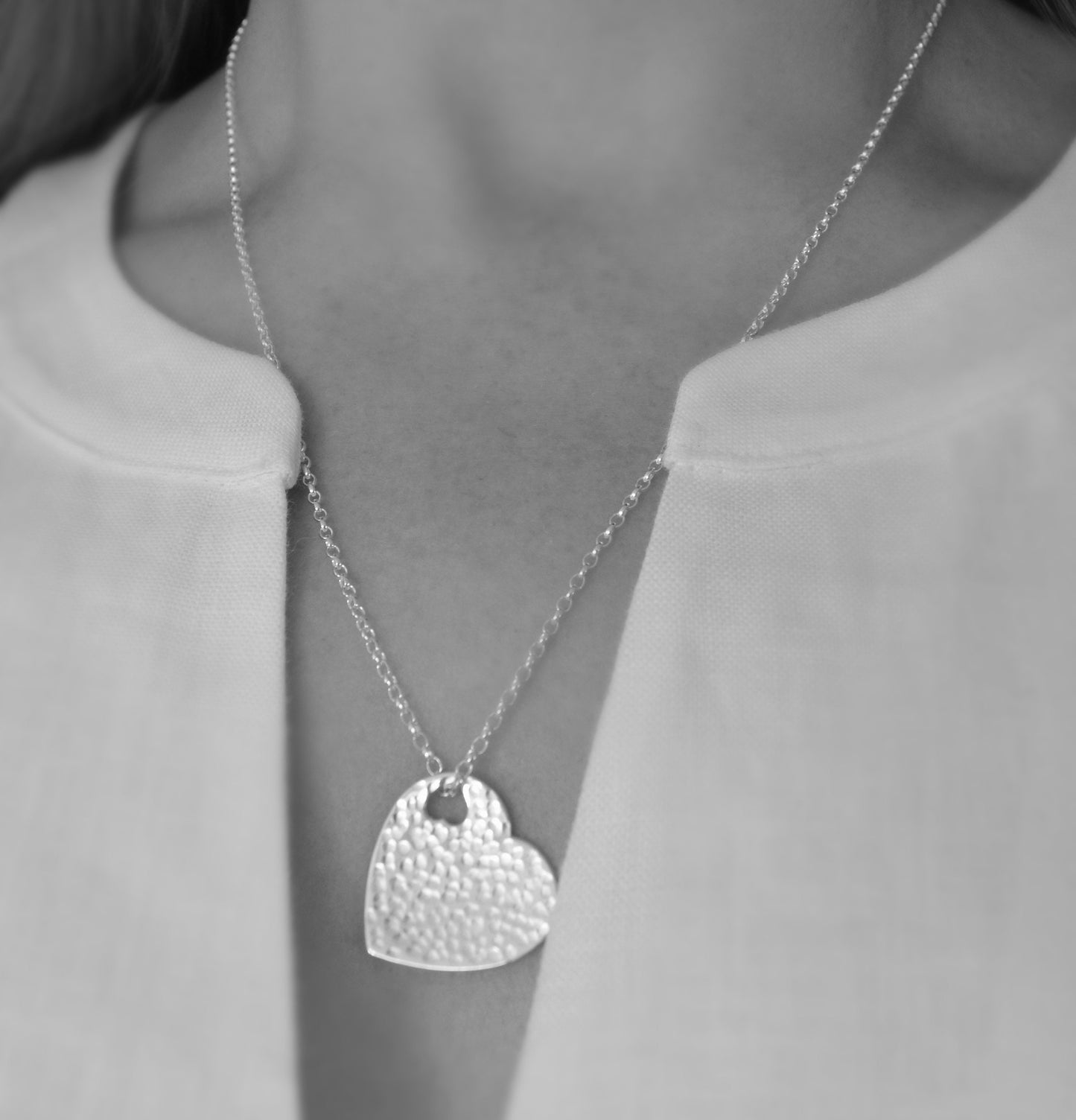 Hammered sterling silver heart necklace pendant.