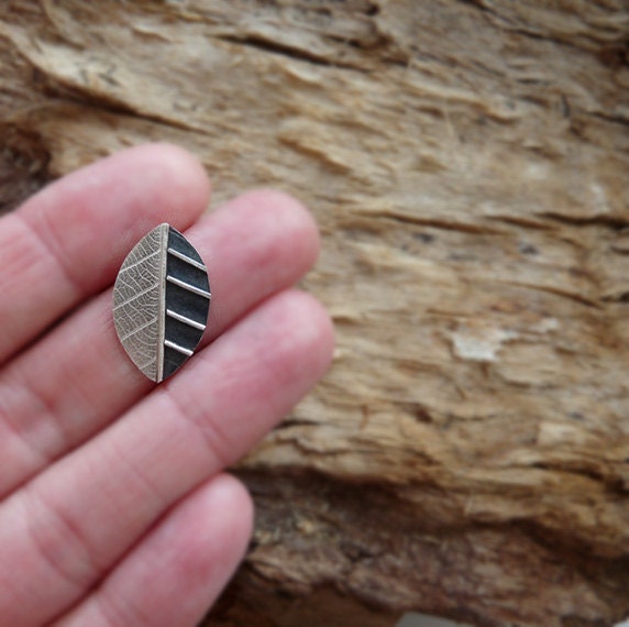 Sterling silver leaf stud earrings.