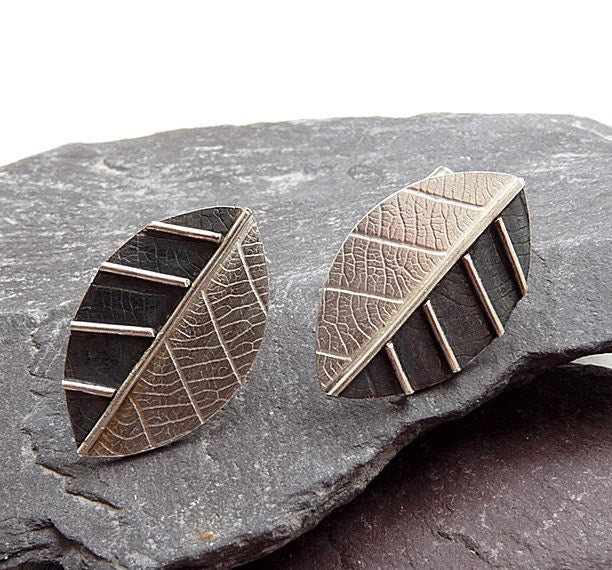 Sterling silver leaf stud earrings.