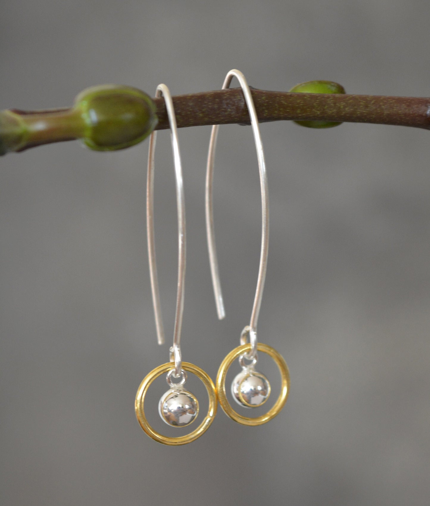 Ball and circle sterling silver and 24k gold vermeil dangle earrings.