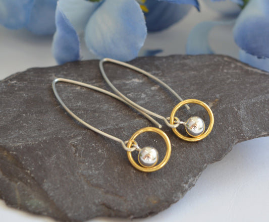 Ball and circle sterling silver and 24k gold vermeil dangle earrings.