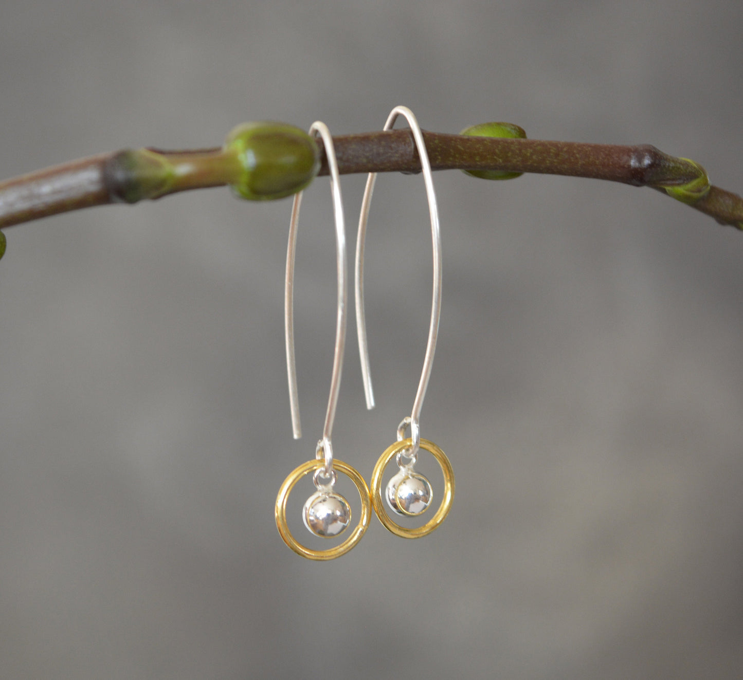 Ball and circle sterling silver and 24k gold vermeil dangle earrings.
