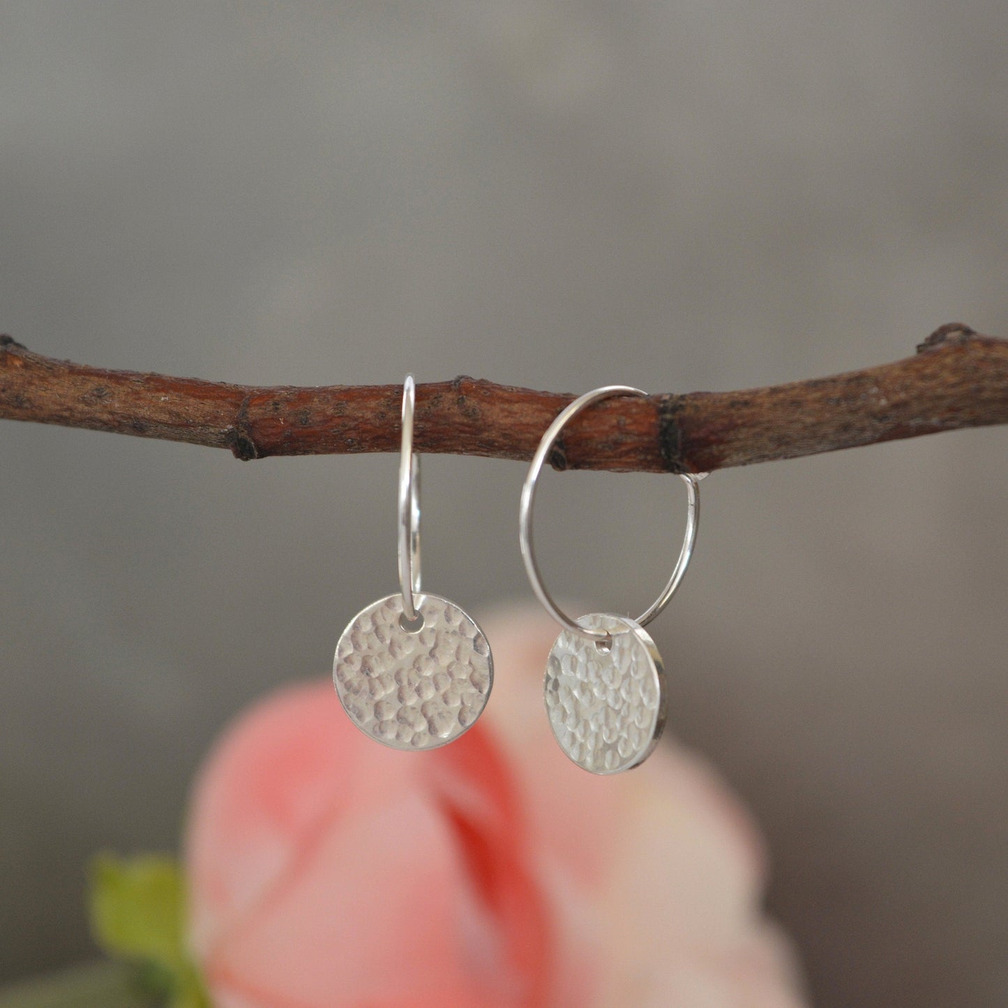 Sterling silver disc charm hoop earrings.