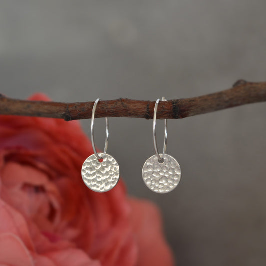 Sterling silver disc charm hoop earrings.