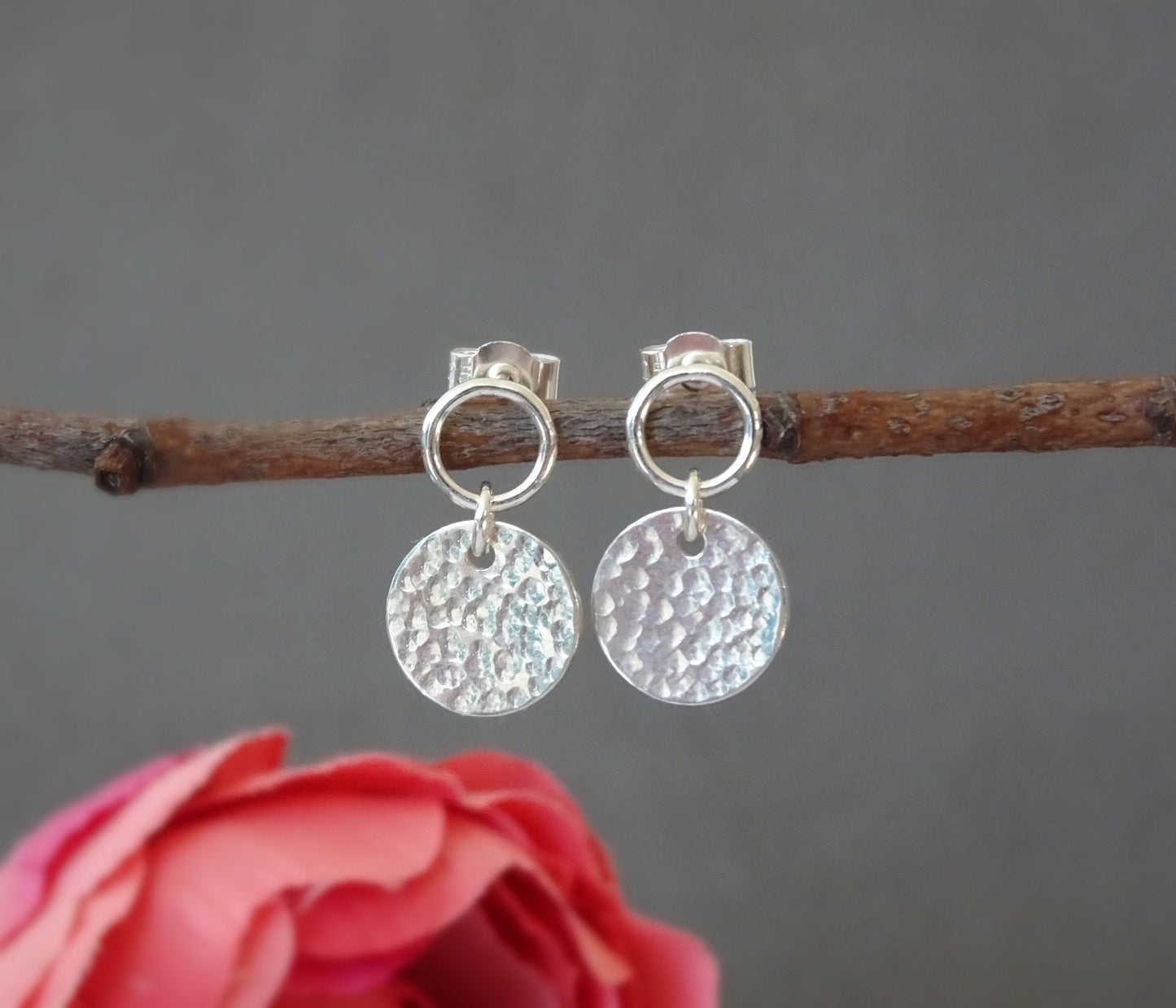 Sterling silver circle and hammered disc stud earrings.