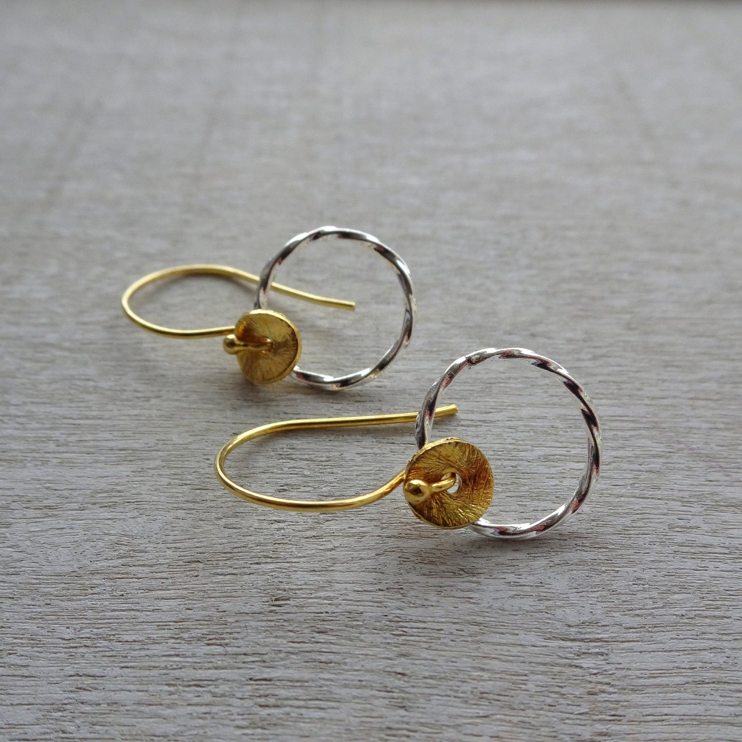 Sterling silver twisted circle earrings.