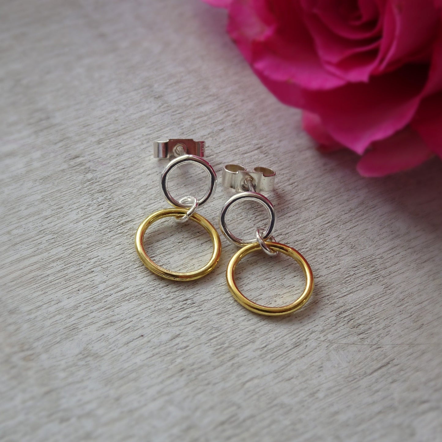Gold and silver two circles stud earrings.