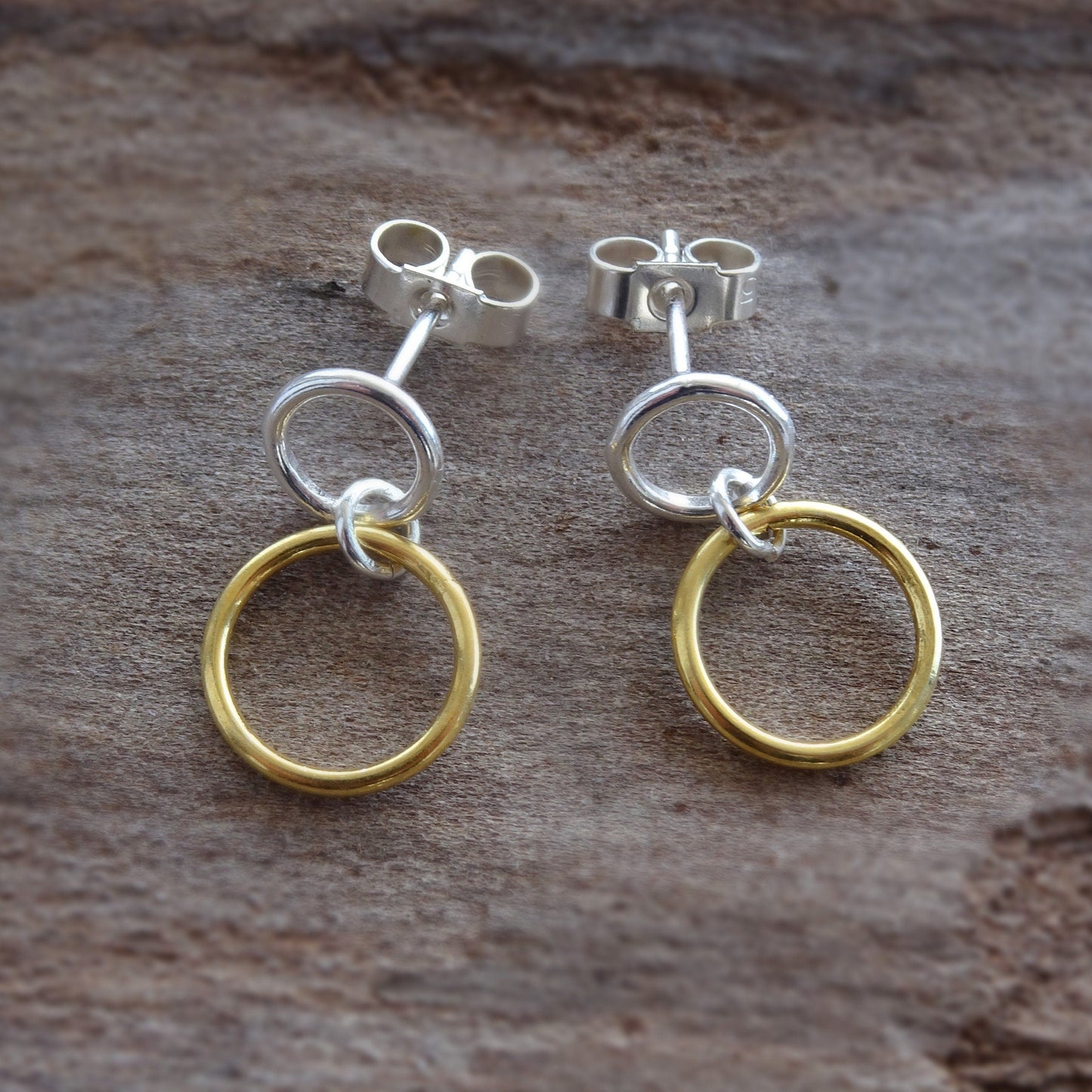 Gold and silver two circles stud earrings.