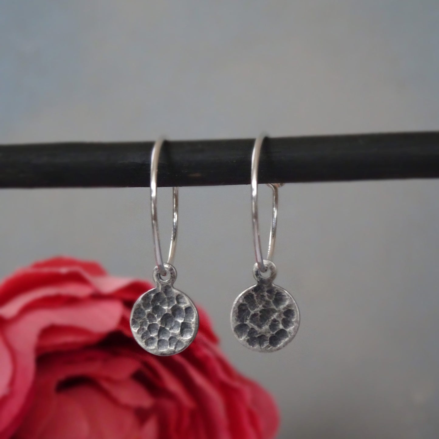 Hammered sterling silver disc charm hoop earrings.