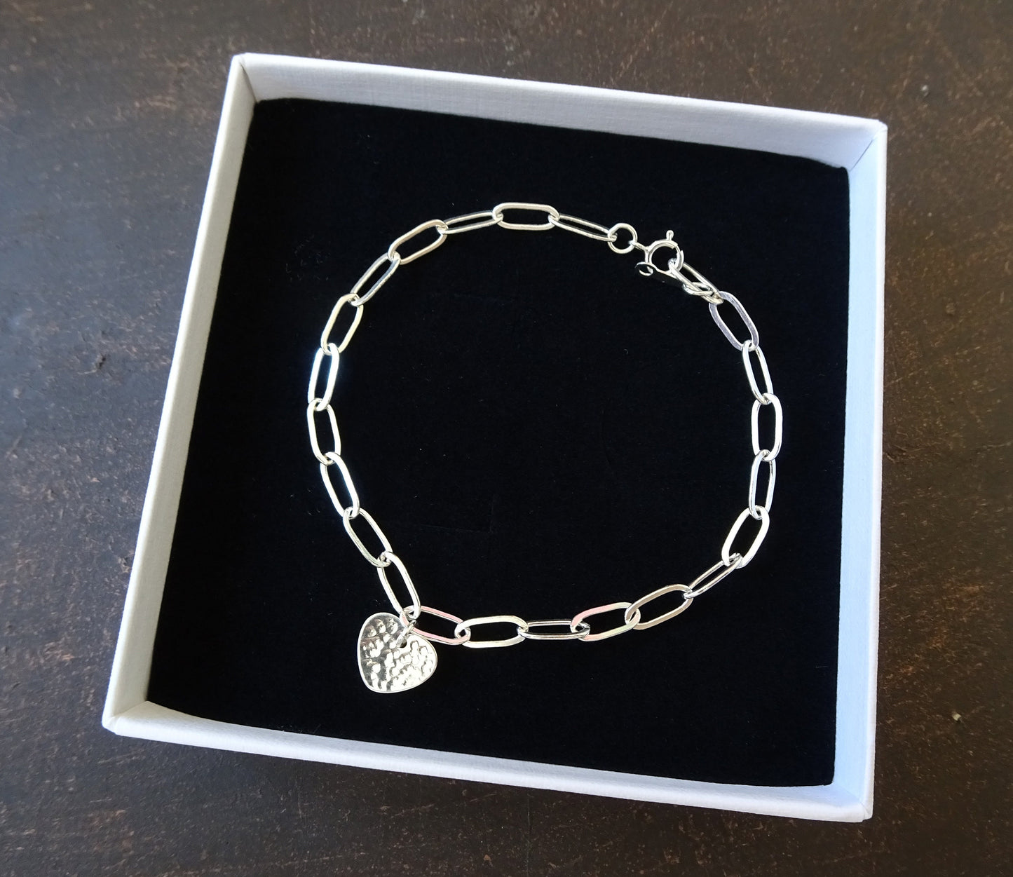 Sterling silver disc charm cable chain bracelet.