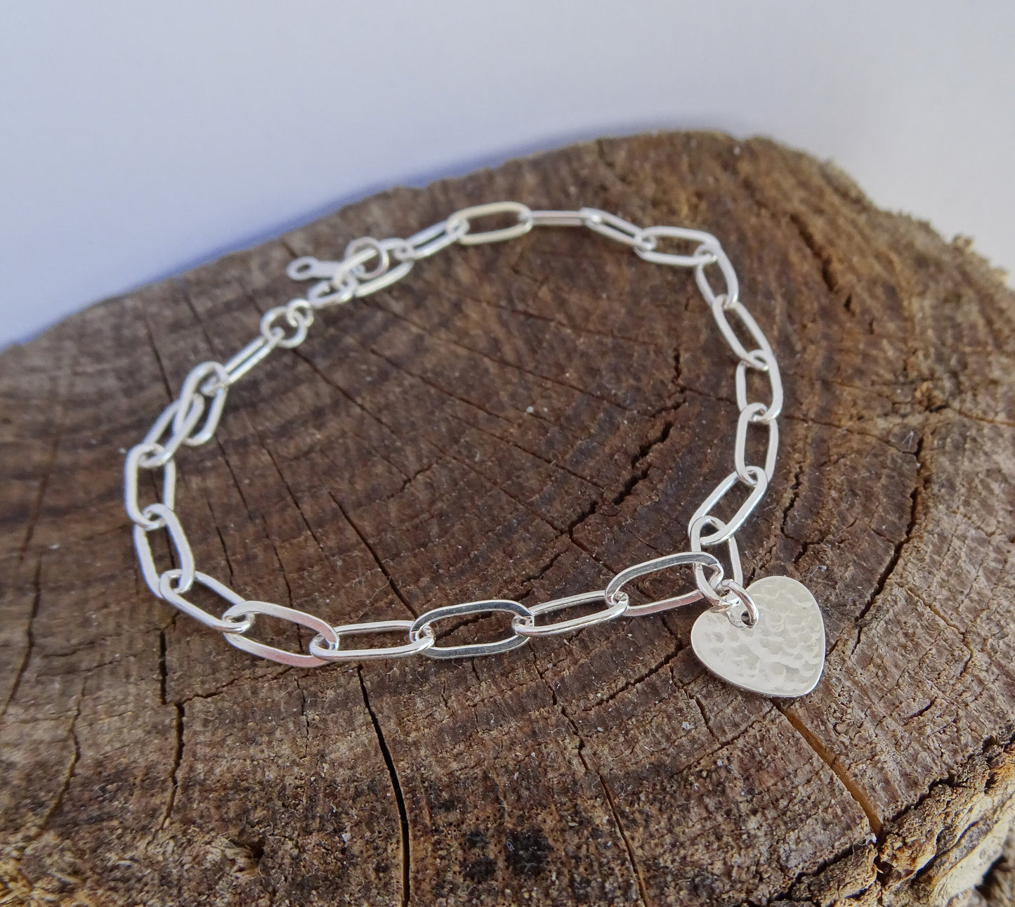 Sterling silver heart charm bracelet.