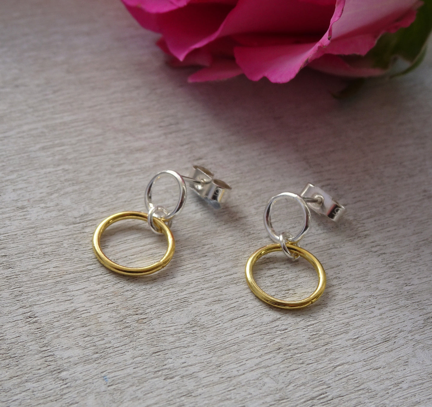Gold and silver two circles stud earrings.