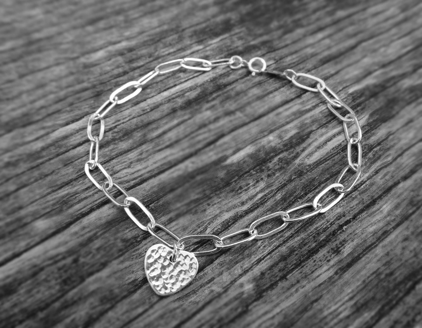 Sterling silver heart charm bracelet.