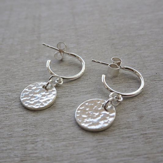 Sterling silver disc charm half hoop earrings.