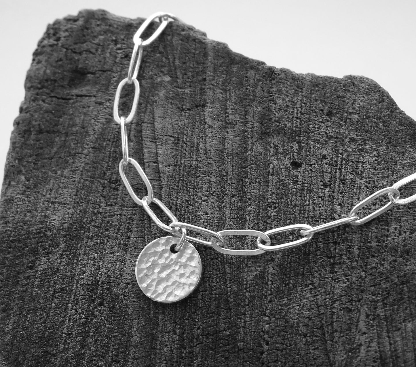 Sterling silver disc charm cable chain bracelet.
