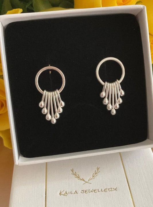 Sterling silver dangle earrings.