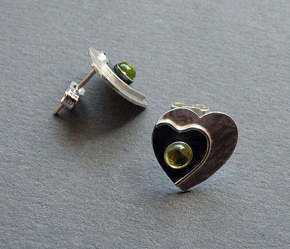 Peridot sterling silver heart stud earrings.