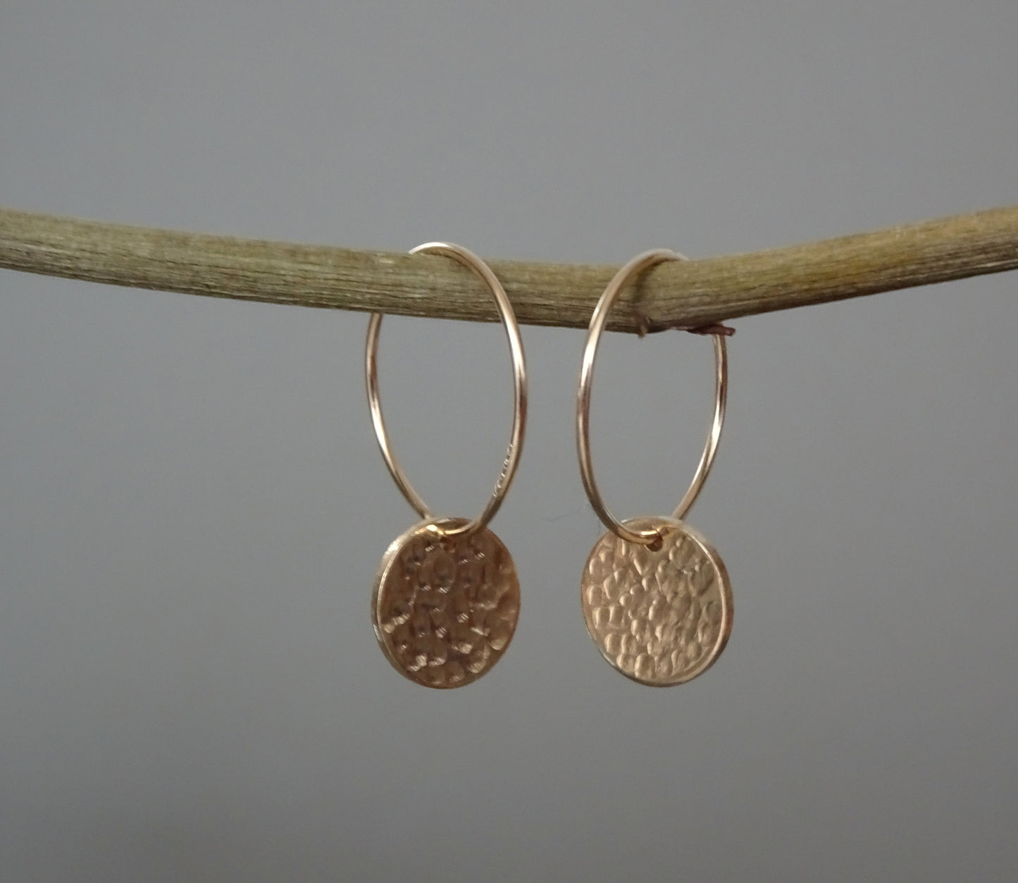 14k Gold filled hammered disc hoop earrings.