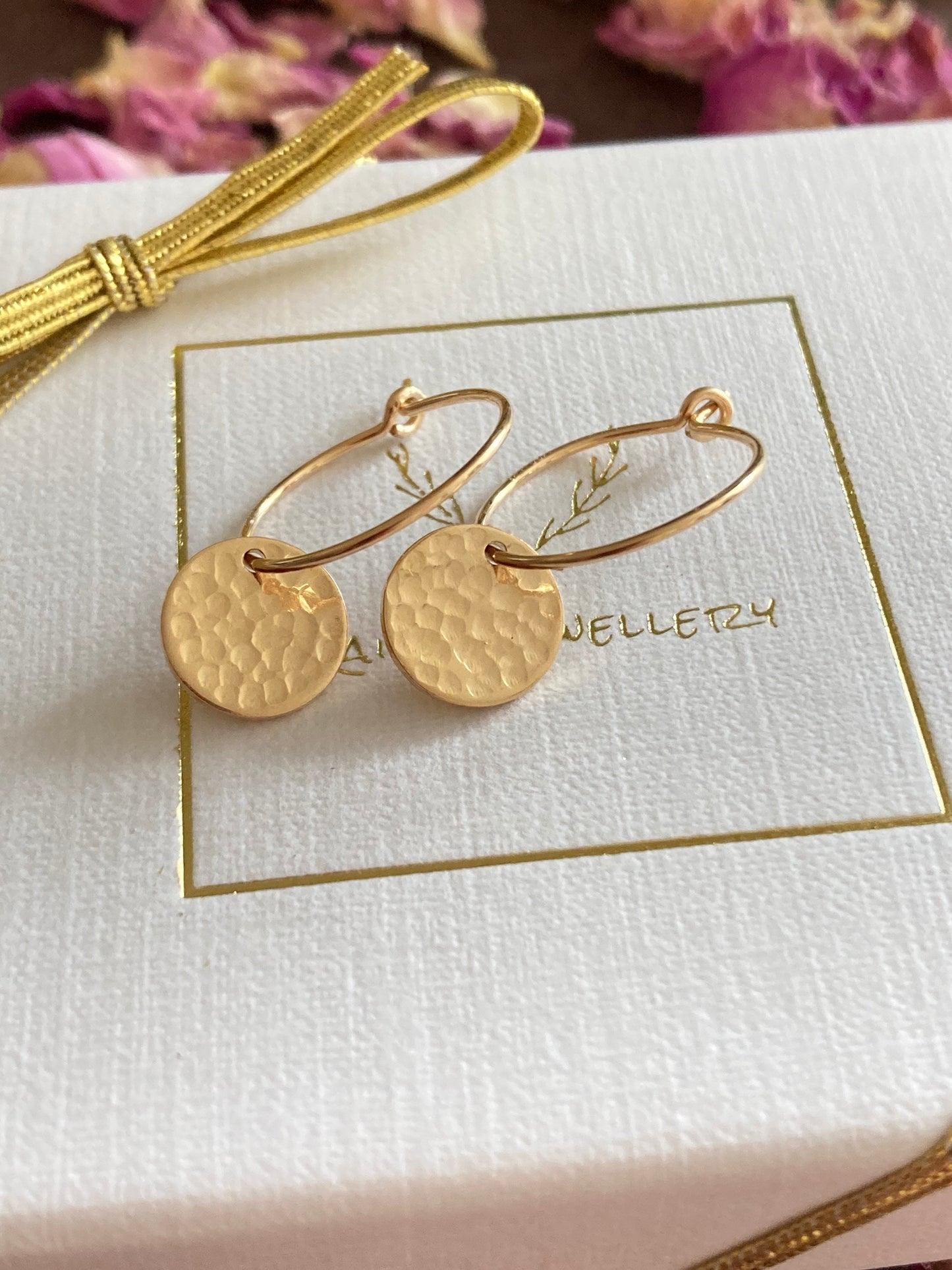 14k Gold filled hammered disc hoop earrings.