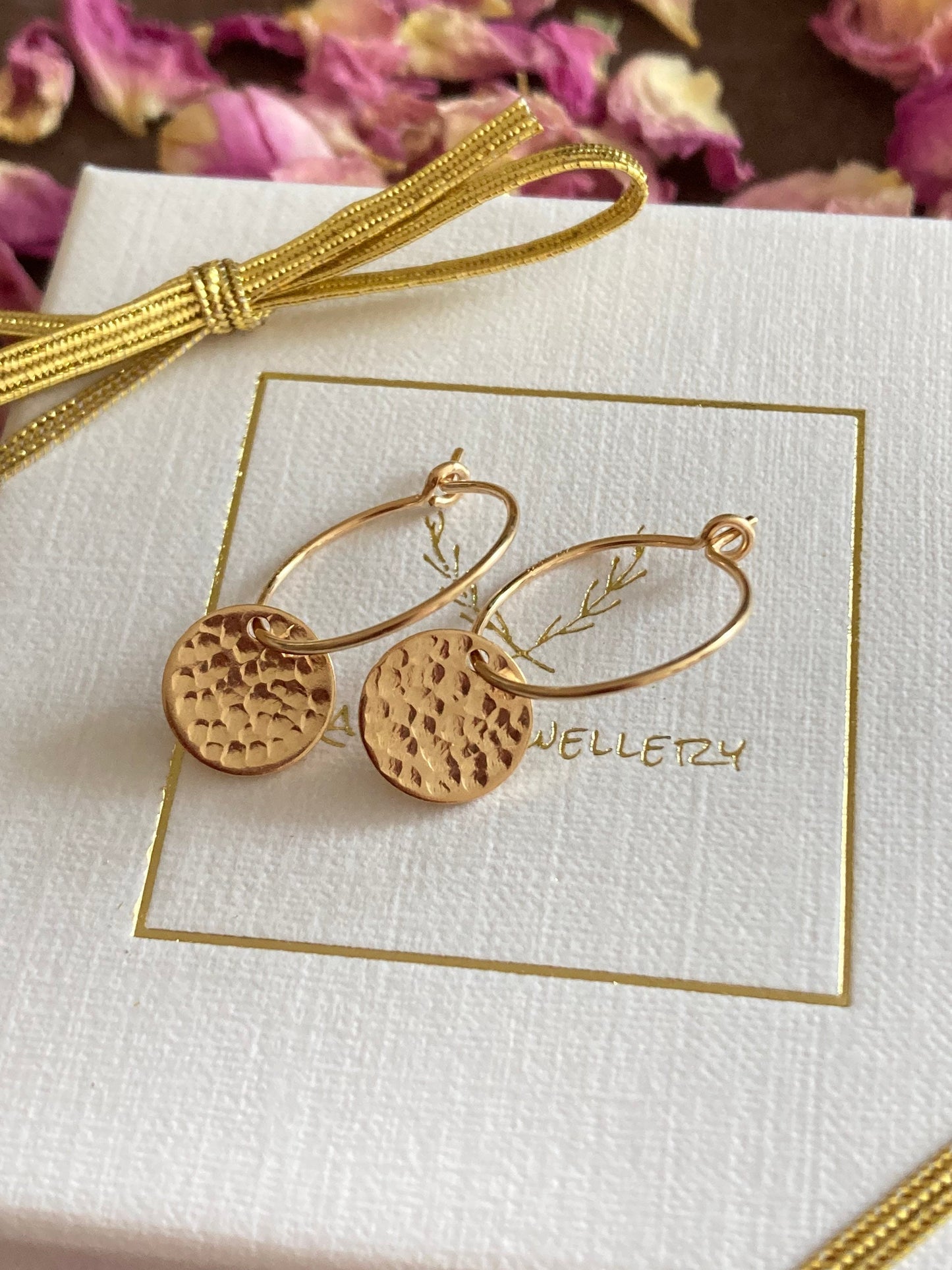 14k Gold filled hammered disc hoop earrings.